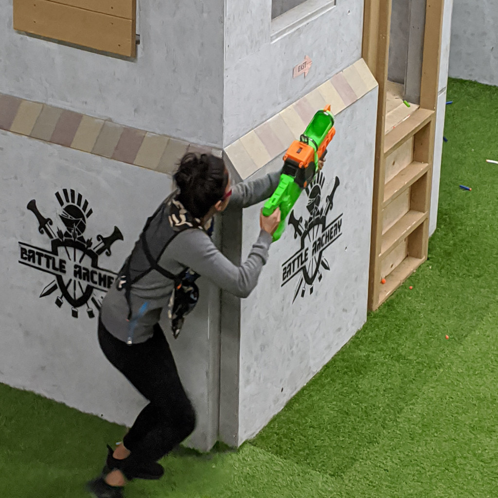 nerf blaster aiming at kids in nerf arena